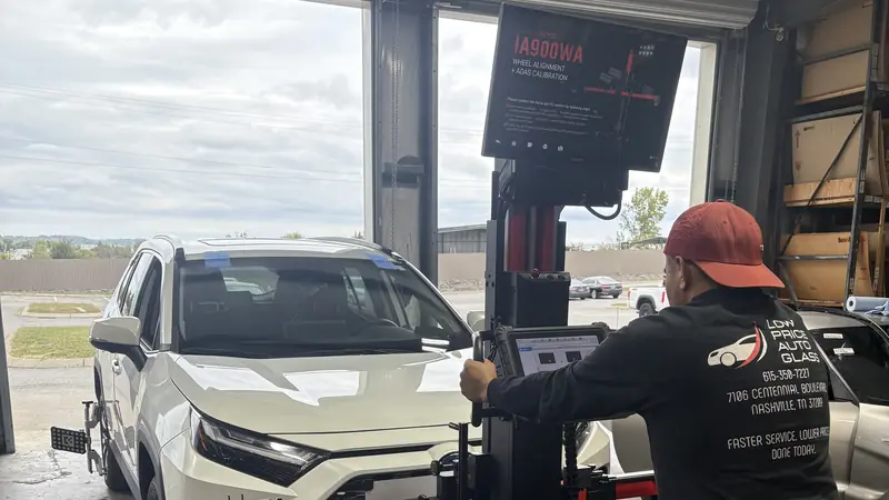 ADAS camera calibration on a Toyota RAV4: technician at the calibration stand at our Nashville shop