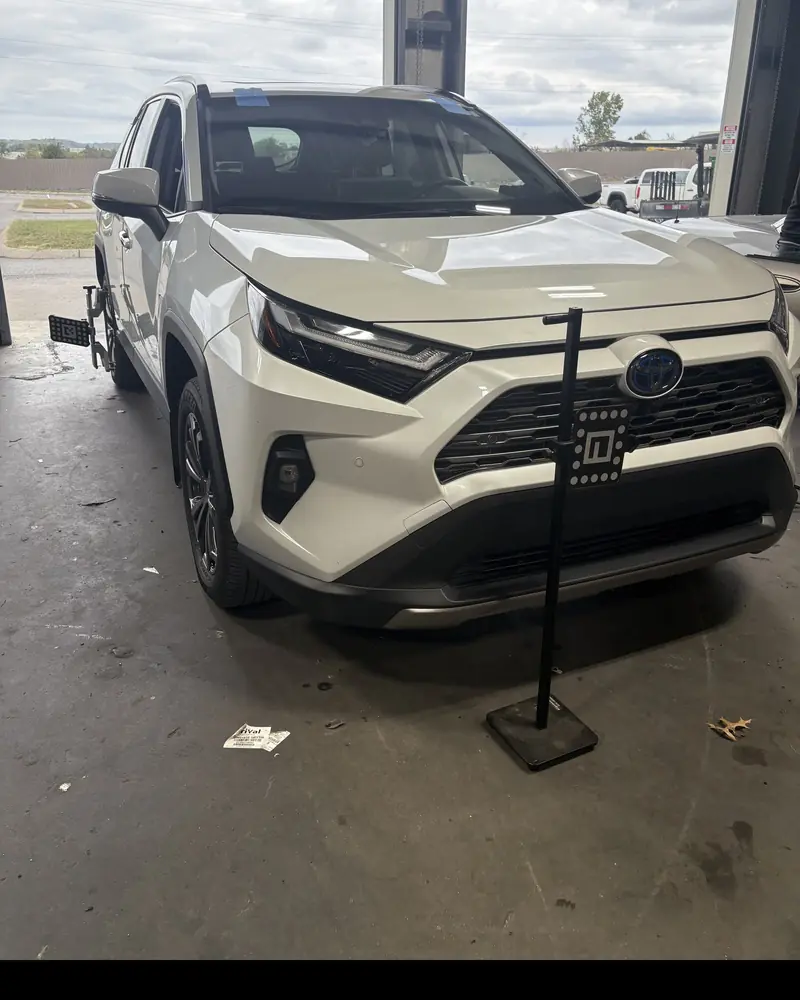 ADAS calibration equipment positioned in front of a Toyota RAV4