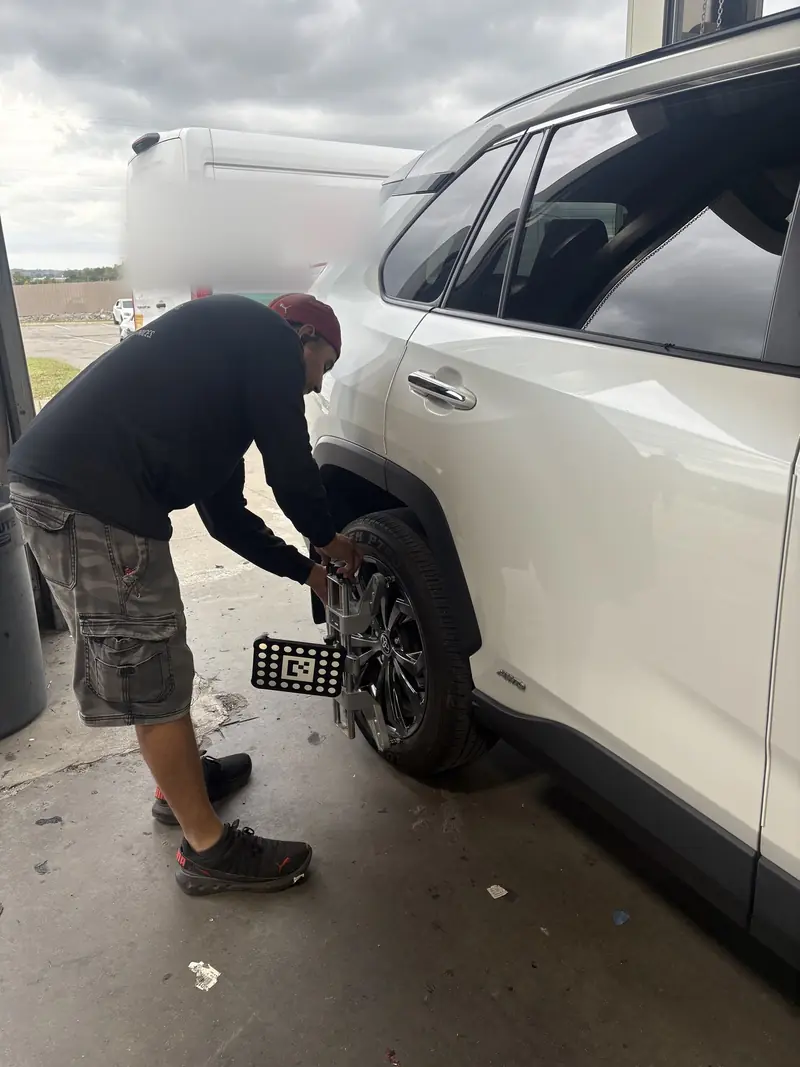 ADAS wheel target being mounted on a Toyota RAV4 before camera calibration at our Nashville shop