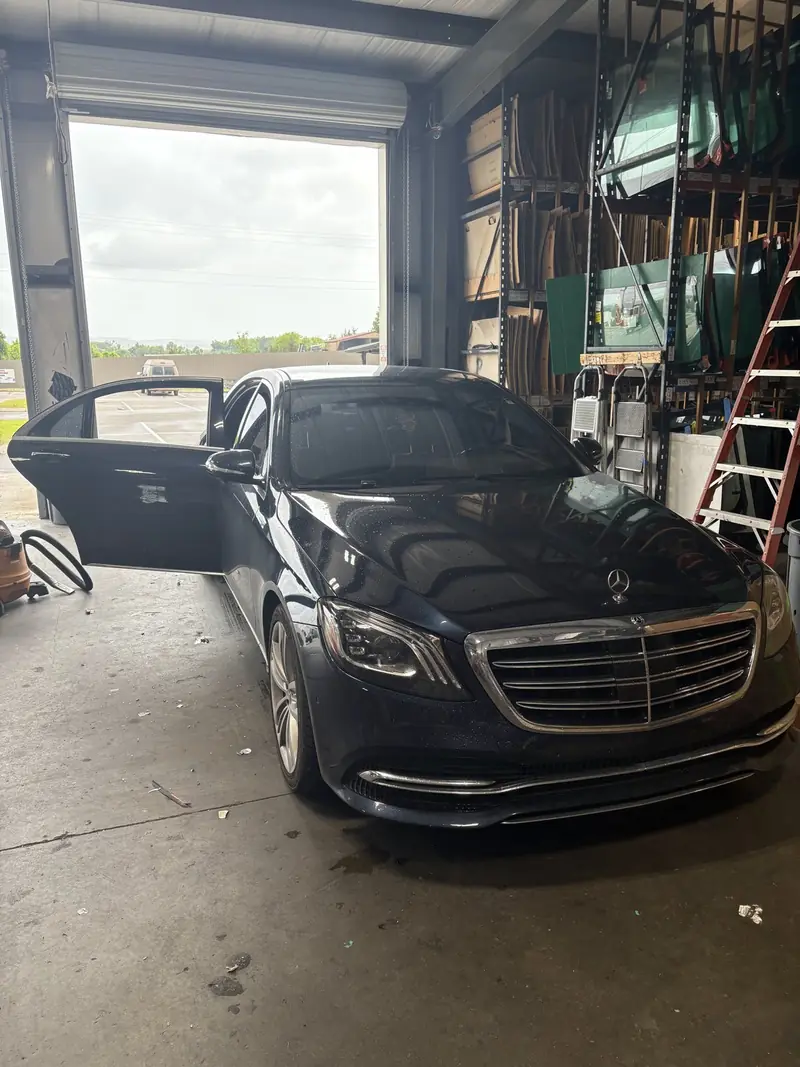 A vehicle beside our in-house glass inventory