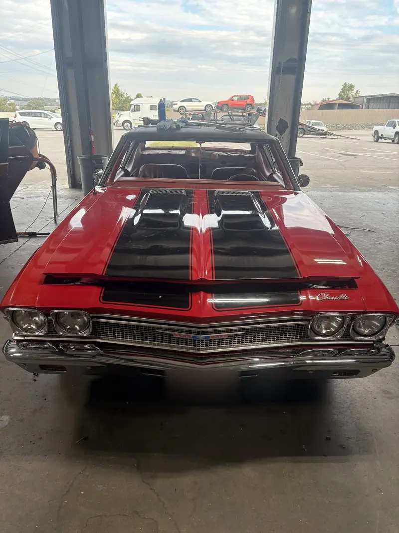 Red classic Chevelle photographed by Low Price Auto Glass