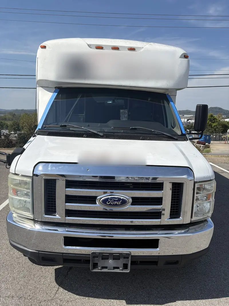 Ford shuttle bus photographed by Low Price Auto Glass